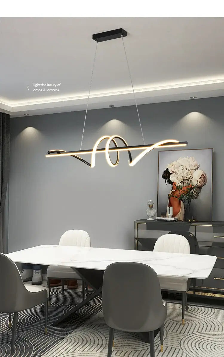 Modern LED pendant light hanging above a white dining table in a stylish, minimalist living room setting.