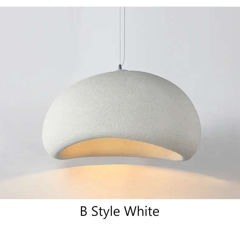 Modern white pendant lamp with a curved design, perfect for dining rooms and home decor.