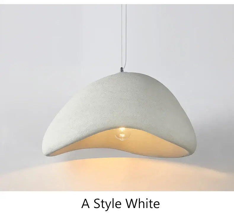 Modern minimalist white pendant light with a unique curved design for dining and home decor.