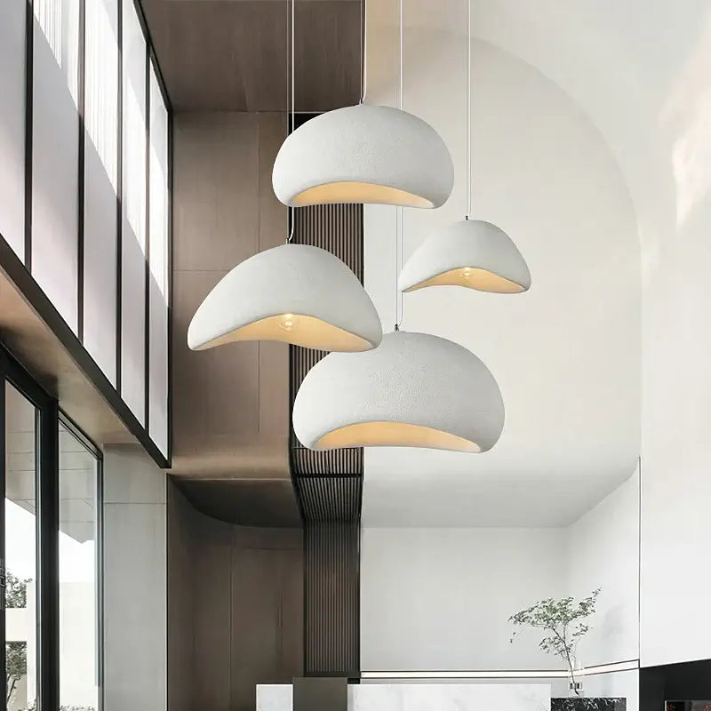 Modern Nordic pendant lights with curved design, ideal for dining rooms and lofts, enhancing minimalist home decor.