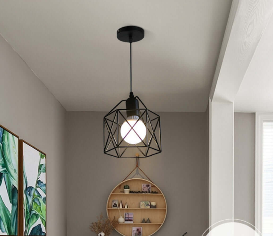 Nordic creative metal pendant light fixture hanging in a modern living space with decorative wall art.