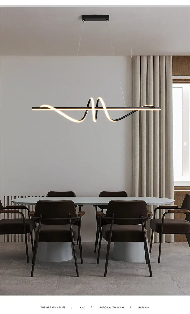 Modern minimalist LED pendant light hanging above a dining table in a stylish interior setting.