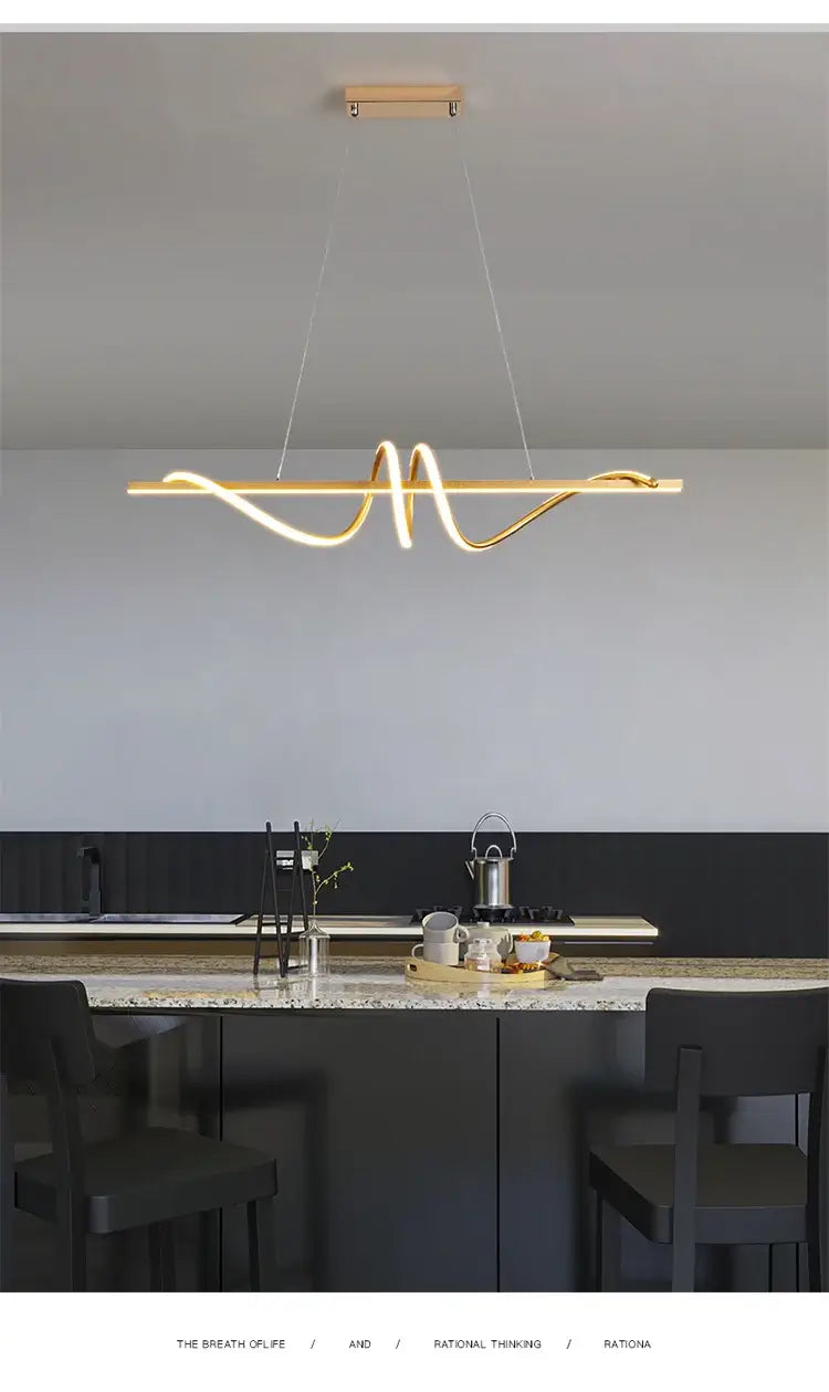 Modern minimalist LED pendant light above a kitchen island, enhancing home decor with elegant design.