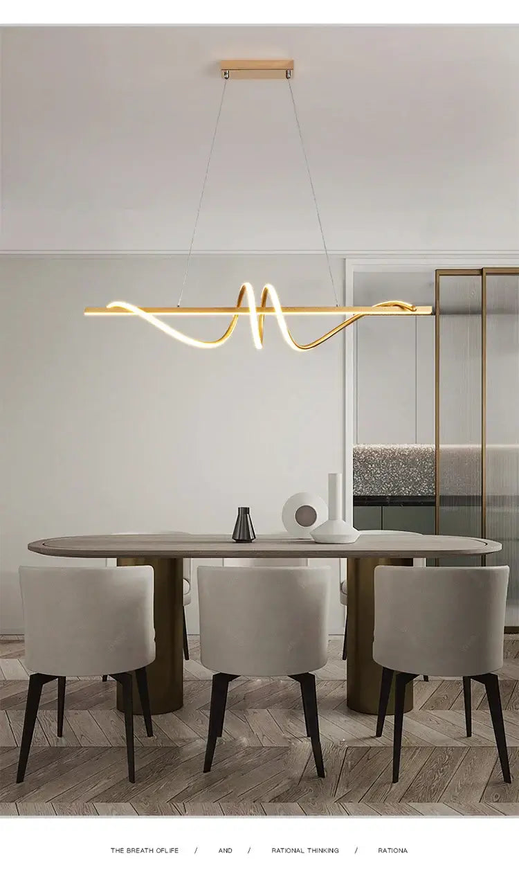 Modern LED pendant light hanging over a minimalist dining table in a stylish interior setting.