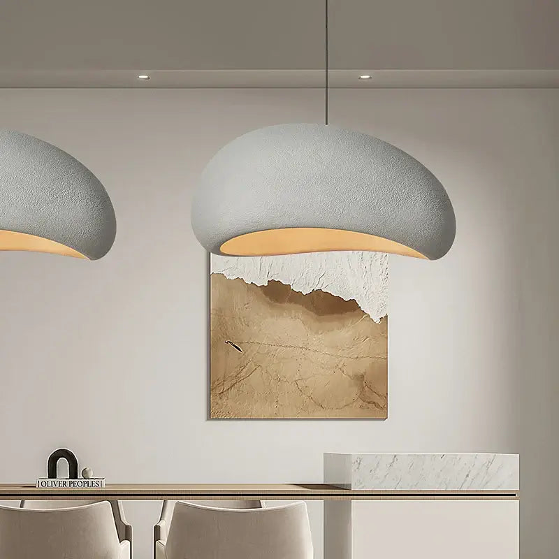 Nordic minimalist wabi-sabi E27 LED pendant light in stylish dining room setting with artwork and modern decor.