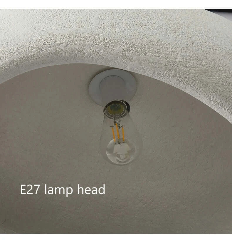 E27 lamp head installed in a minimalistic ceiling fixture with a textured surface.